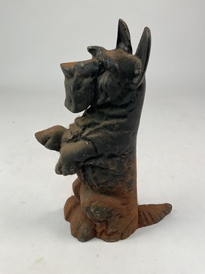 Lot 132 - A cast iron doorstop in the form of a Scottish...