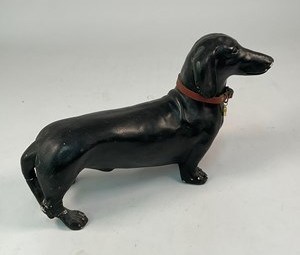 Lot 23 - A 20th century black painted figure of a...