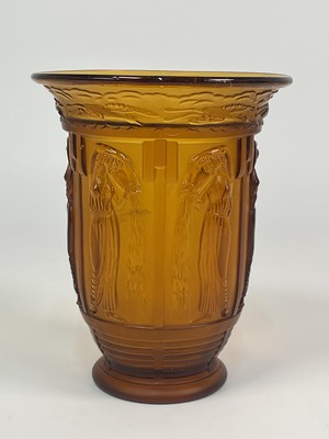 Lot 260 - An Art Deco amber glass vase depicting...