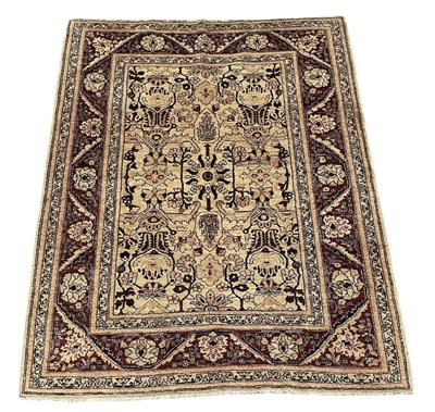 Lot 109 - A hand woven Oriental cream ground carpet, the...