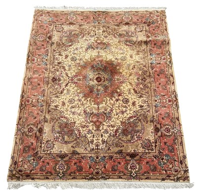 Lot 104 - A hand woven silk and wool ground Tabriz...