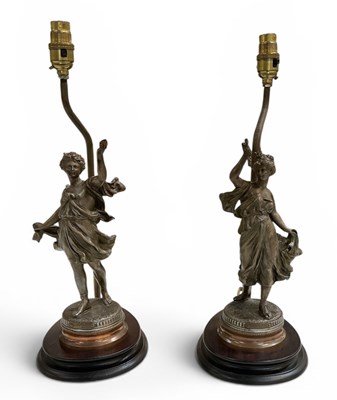 Lot 579 - A pair of reproduction bronzed spelter figural...