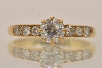 Lot 1291 - An 18ct yellow gold diamond set ring, the...