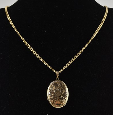 Lot 1352 - A 9ct yellow gold oval double locket, with...