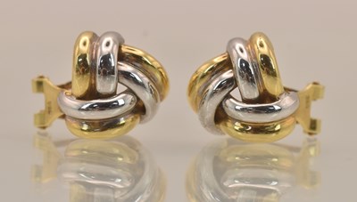 Lot 1385 - A pair of 18ct yellow and white gold knot stud...