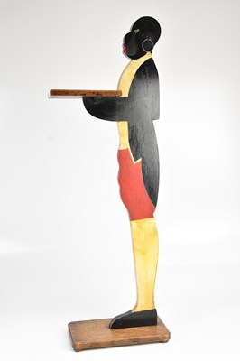 Lot 2057 - A painted blackamoor dumb waiter, height 89cm.
