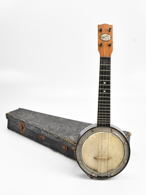 Lot 2195 - SWANEE; a cased banjolele.