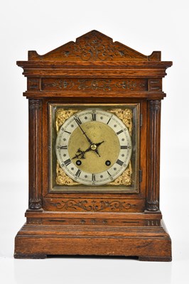 Lot 1375 - An oak cased bracket clock, with brass dial...