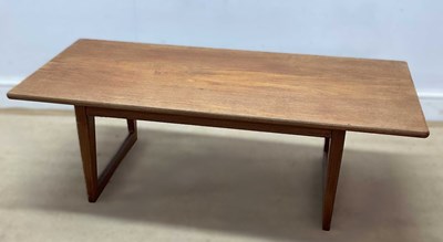 Lot 663 - A mid 20th century teak coffee table on sled...