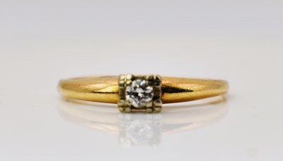 Lot 446 - A yellow gold and diamond solitaire ring, gold...