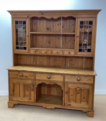 Lot 619 - A pine Welsh dresser with glazed upper...