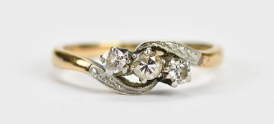 Lot 517 - An 18ct yellow gold and platinum three stone...