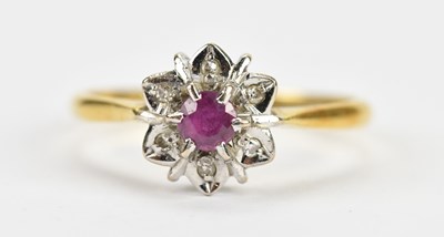 Lot 521 - An 18ct yellow gold illusion set cluster ring,...