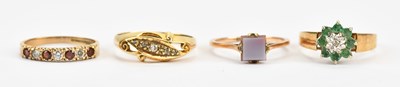 Lot 450 - Four 9ct gold dress rings including a...