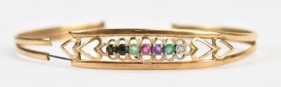 Lot 38 - A yellow metal 'Dearest' bangle set with seven...