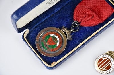 Lot 11 - A 9ct yellow gold and enamel Trade Union...