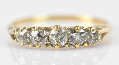 Lot 427 - An 18ct yellow gold diamond set five stone...
