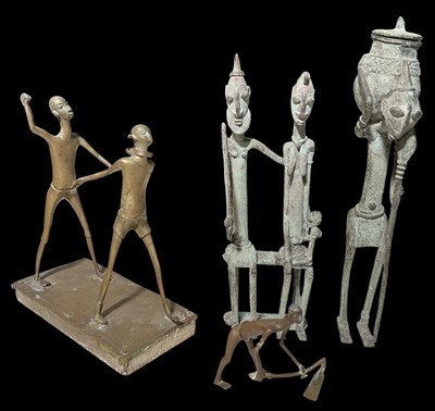 Lot 1002 - Four African Benin bronze figures comprising a...