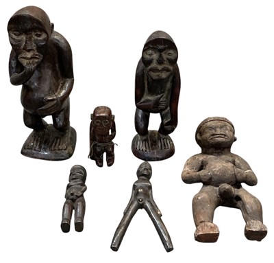 Lot 1004 - Six African carved wooden tribal figures,...