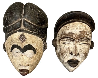 Lot 1021 - Two African carved wooden tribal painted Punu...