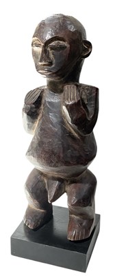 Lot 1022 - An African carved wooden tribal figure,...