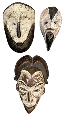 Lot 1016 - An African carved wooden tribal painted bird...