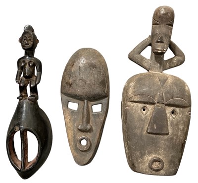 Lot 1006 - Three African carved wooden tribal masks,...