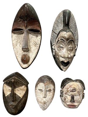 Lot 1013 - Five assorted African tribal carved wooden...
