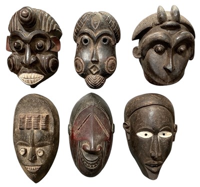 Lot 1012 - Six African carved wooden tribal masks,...