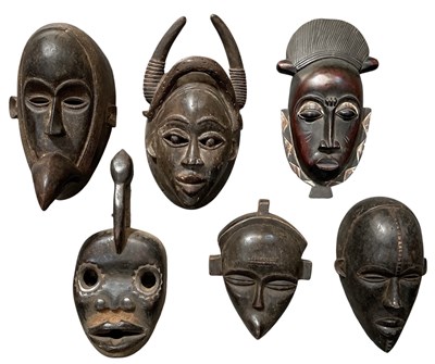 Lot 1011 - Six African carved wooden tribal masks,...