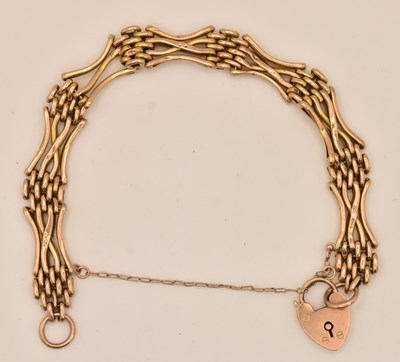 Lot 1413 - A 9ct yellow gold gate link bracelet, with...