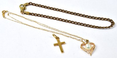 Lot 965 - A 14ct yellow gold heart-shaped pendant set...