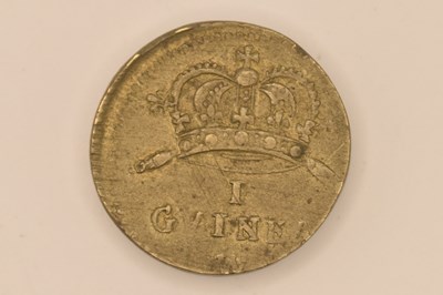 Lot 1766 - A one guinea brass coin weight, diameter 1.9cm,...