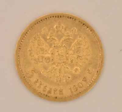 Lot 1476 - A Russian Nicholas II five rouble gold coin,...