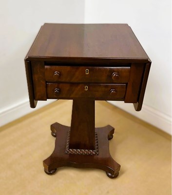 Lot 640 - A 19th century mahogany drop-leaf work table,...