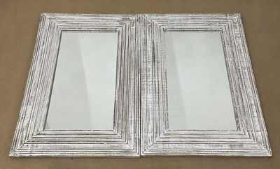 Lot 680 - A pair of rectangular mirrors in limed frames,...