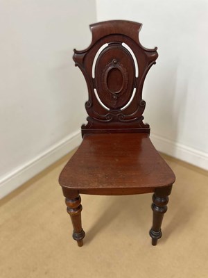 Lot 686 - A Victorian mahogany shield back hall chair,...