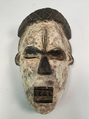 Lot 15 - African tribal mask; possibly by Igbo, Nigeria,...