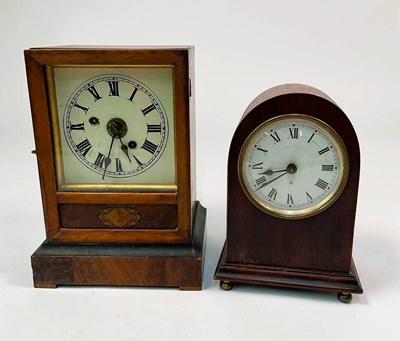 Lot 302 - A late 19th century walnut mantel clock,...