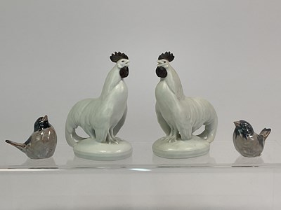 Lot 243 - ROYAL COPENHAGEN; a pair of porcelain models...