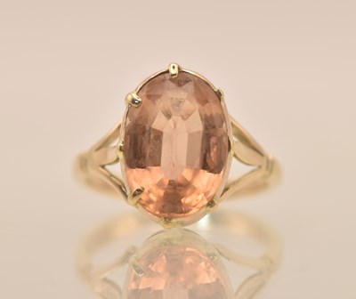 Lot 1313 - A yellow metal citrine set solitaire ring, the...