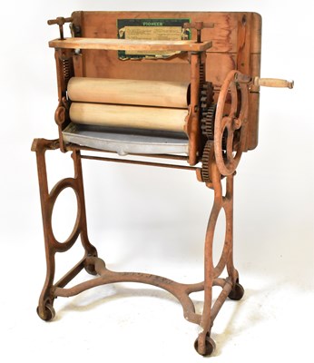 Lot 275 - A vintage Pioneer cast iron mangle with wooden...