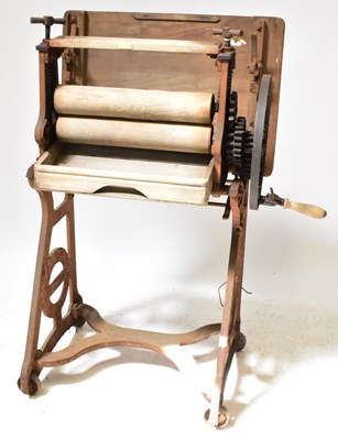 Lot 277 - A Lewis's Ltd cast iron mangle with wheel...