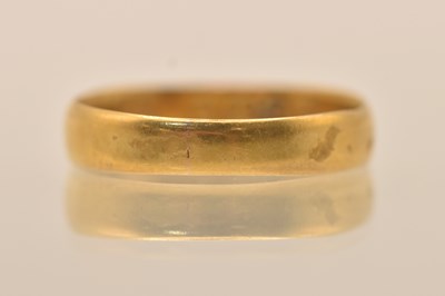 Lot 1300 - A 22ct yellow gold band ring, size O, approx....