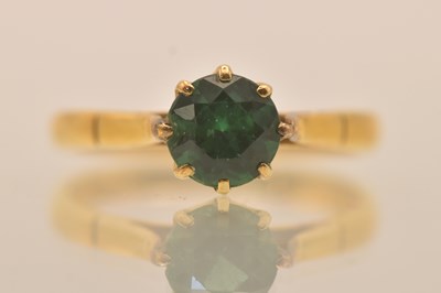 Lot 1295 - A 22ct yellow gold emerald set solitaire ring,...
