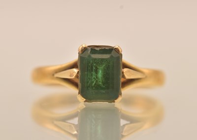 Lot 1296 - A 22ct yellow gold emerald solitaire ring, the...