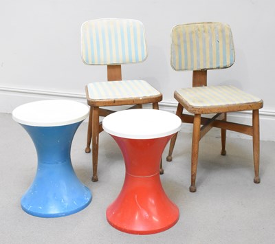 Lot 58 - A pair of retro plastic stools, one red, one...