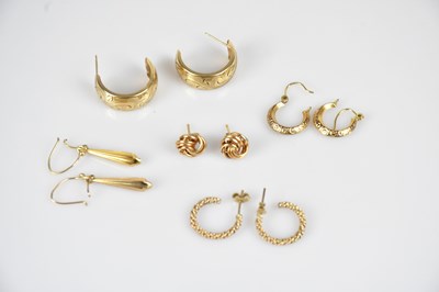 Lot 182 - Four pairs of 9ct yellow gold half hoop...