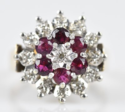 Lot 498 - A 9ct yellow gold diamond and ruby cluster...