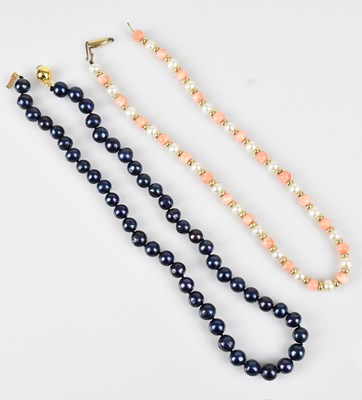 Lot 348 - A single strand cultured pearl and coral...